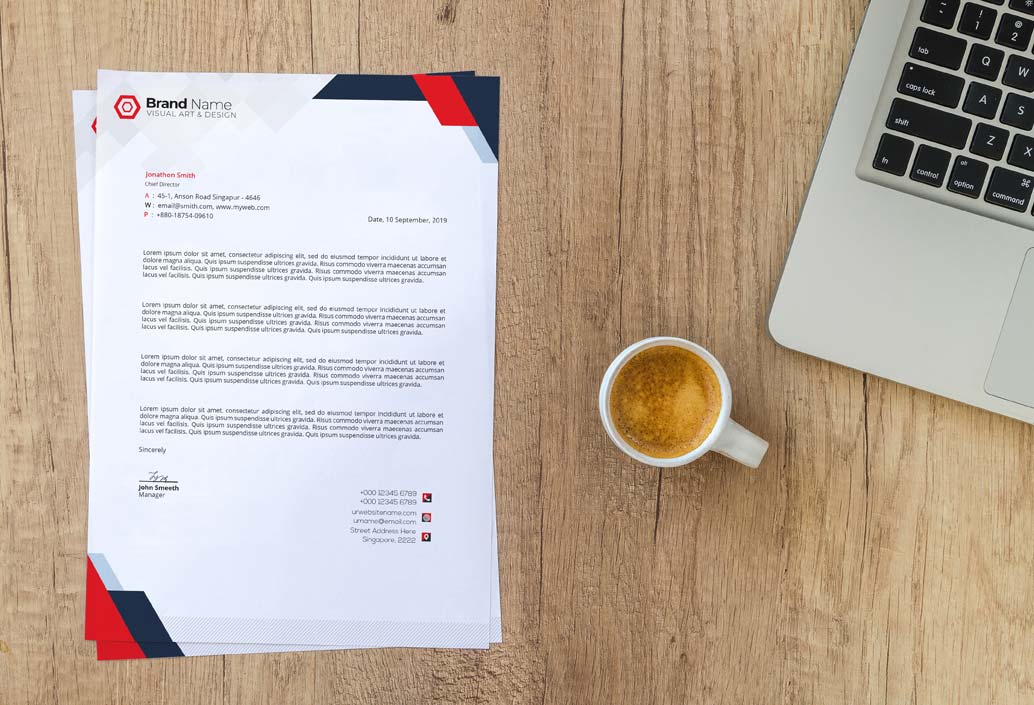 Branded letterhead with coffee and computer